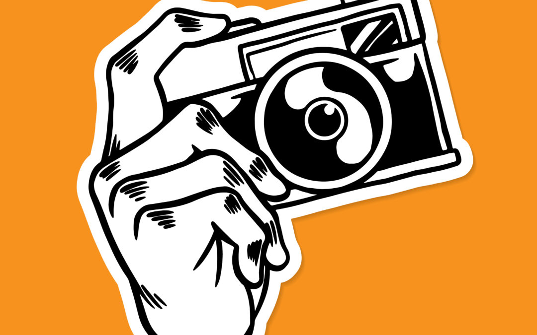 zeig fotografierende Hand an Fotoapparat